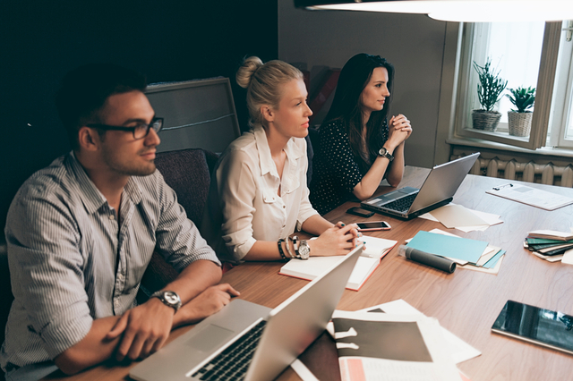 Group of business people working in the same office