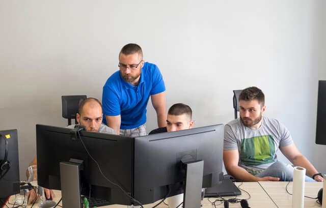 Male programmers working together