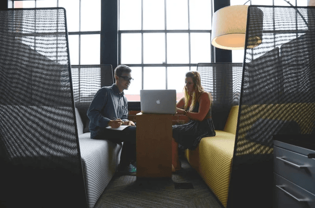 Man and women looking at a laptop