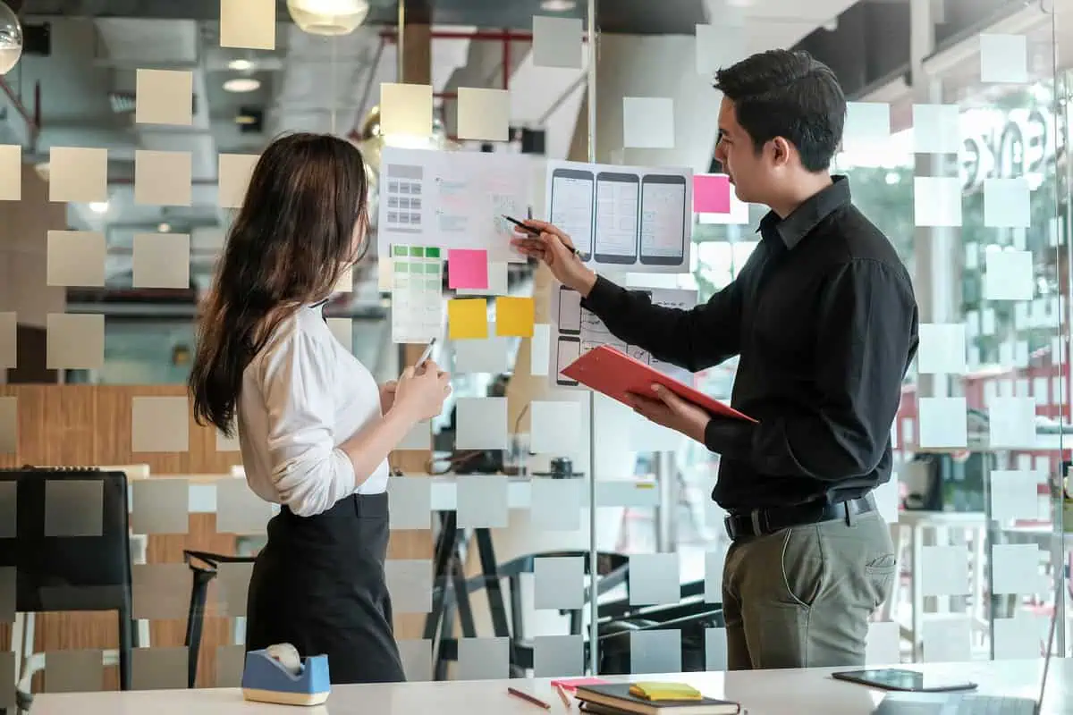 UX designers discussing a project