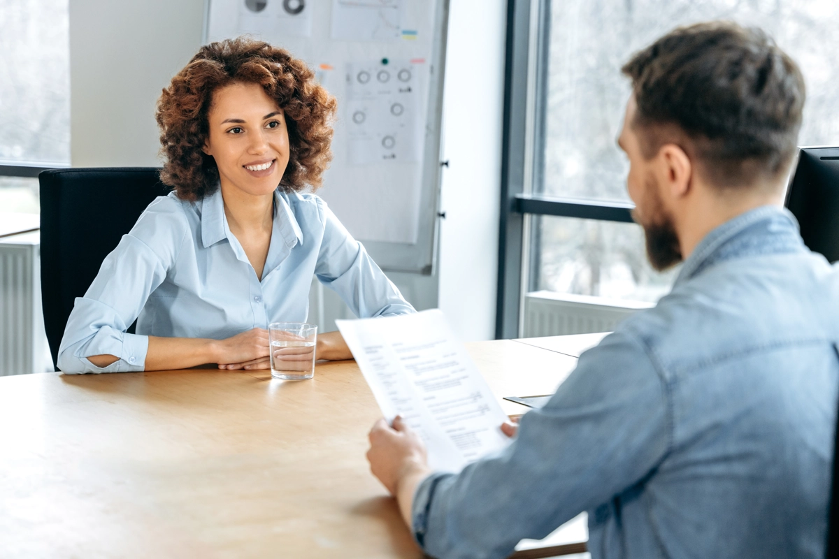 Austin-based Recruiter having an interview in his office