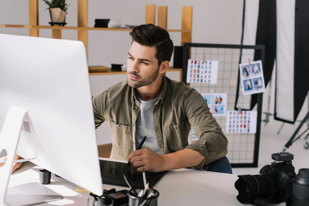 Senior Graphic Designer working on computer