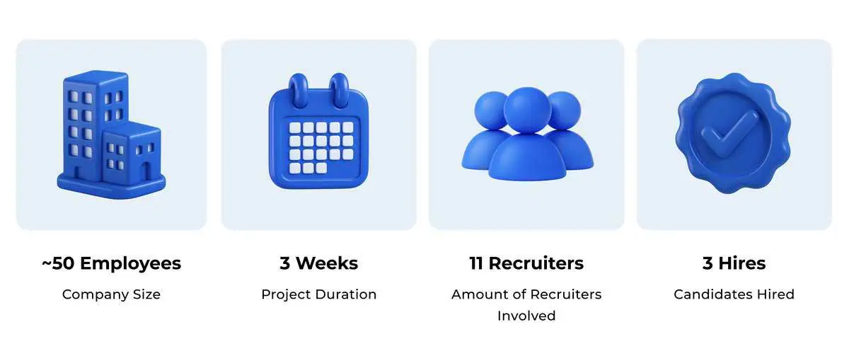 Graphic designer with tattoos working at a desk with a digital tablet and computer.