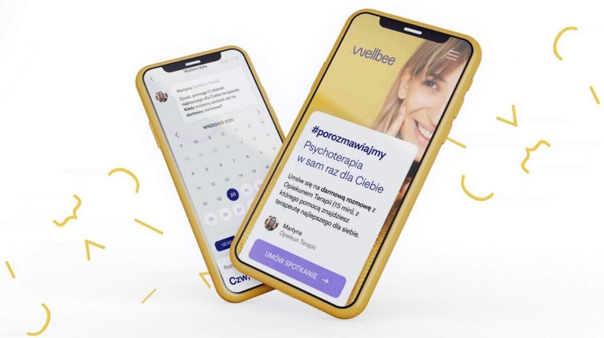 Graphic designer with tattoos working at a desk with a digital tablet and computer. testimonial