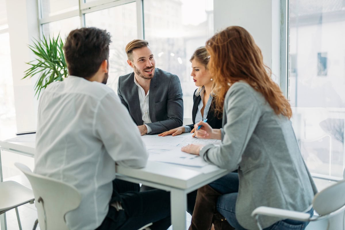 Startup owner at the meeting with professionals from an established recruitment agency. testimonial