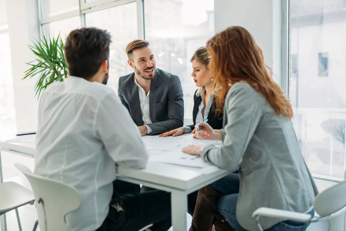 Startup owner at the meeting with professionals from an established recruitment agency.